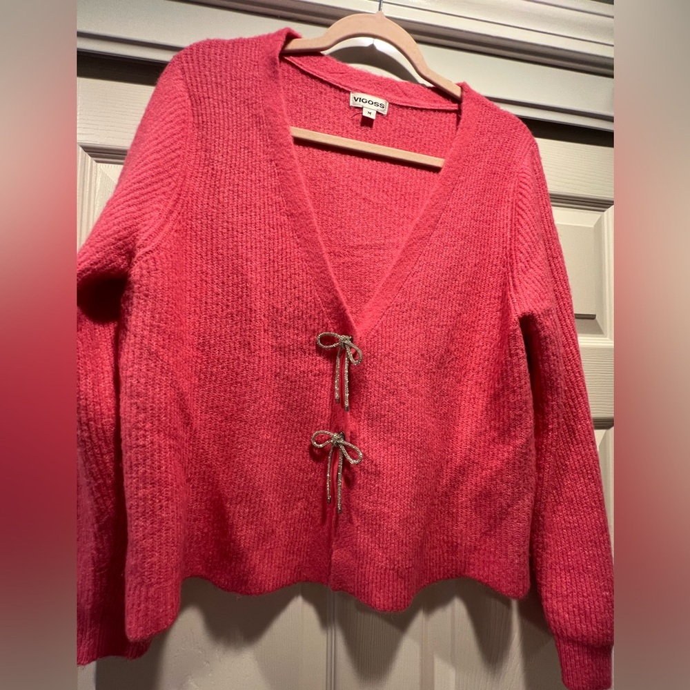 Women’s Coral Color Cardigan snap off rhinestone bow buttons. Super cute!